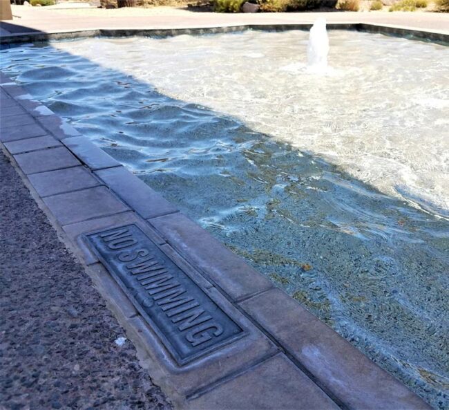 This 5 inch deep water feature has a 'No Swimming' sign posted