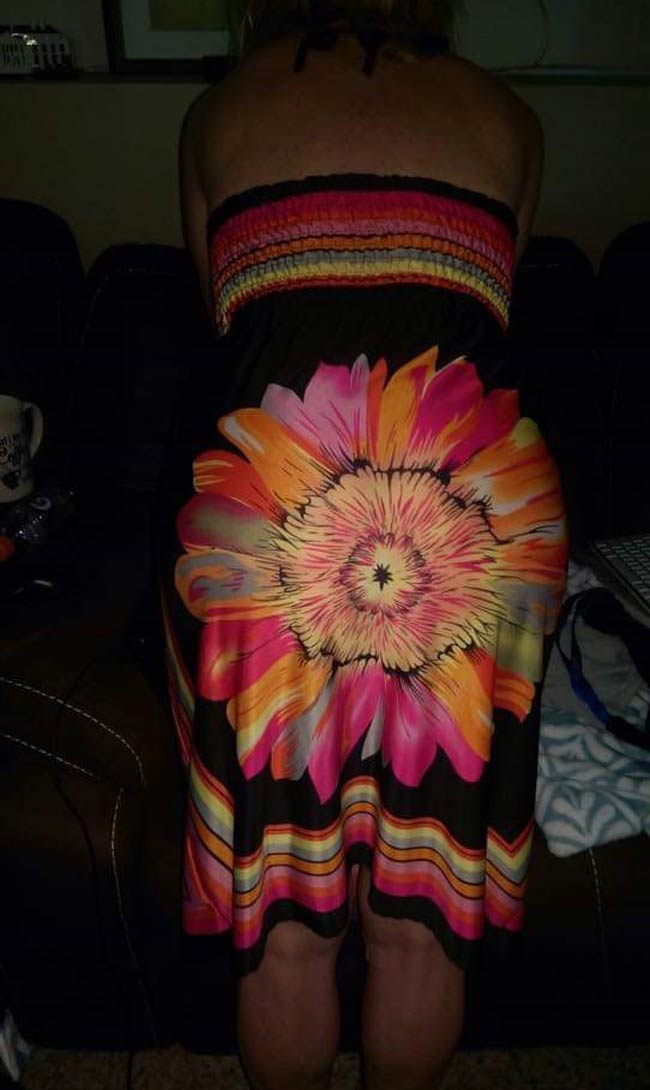 Check the placement of the flower before you buy the dress ladies.