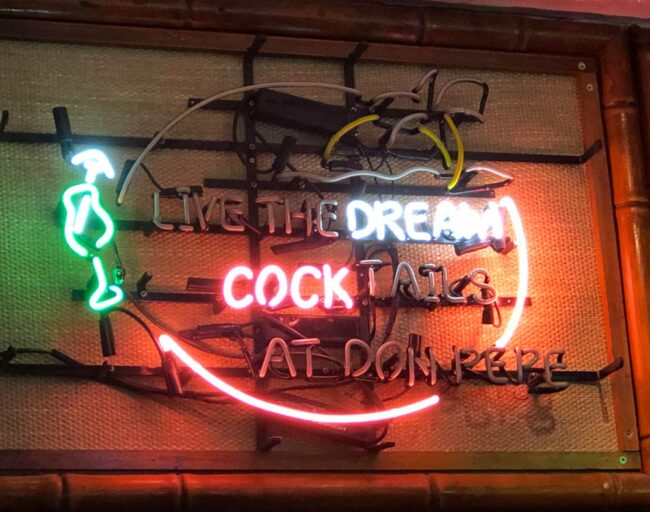 This broken sign in a bar near me