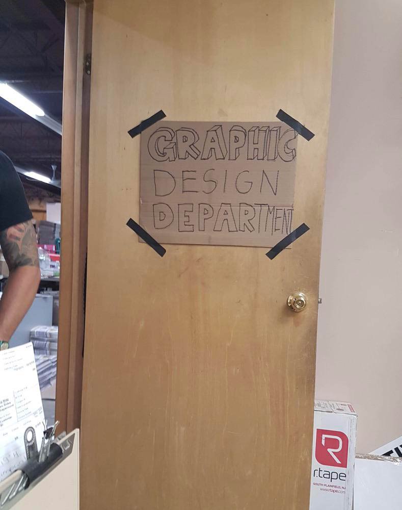 The sign on my husband's graphic design department door