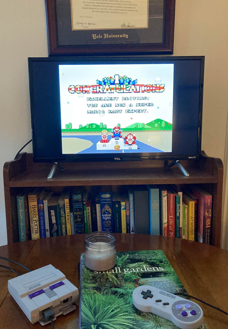 After 20 or so years, I finally beat Super Mario Kart. Here’s the trophy screen in front of my wife’s Yale diploma
