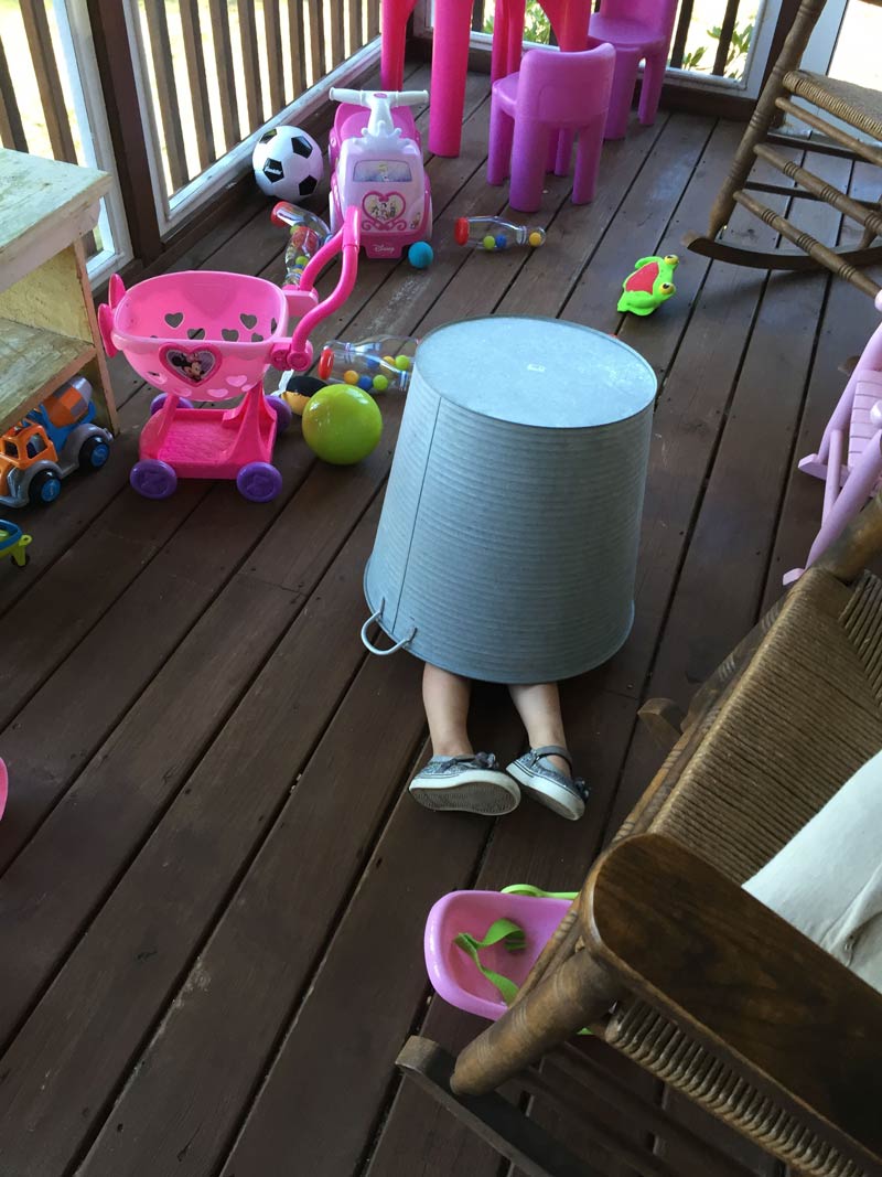 My three-year-old granddaughter playing hide and seek