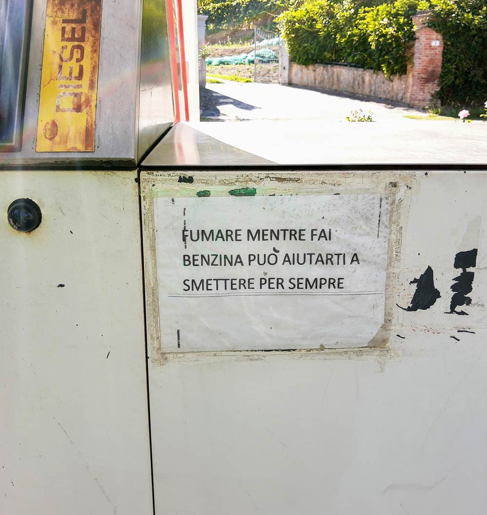 Found at a gas pump in Italy, it says "Smoking while refueling can help you quitting smoking forever"