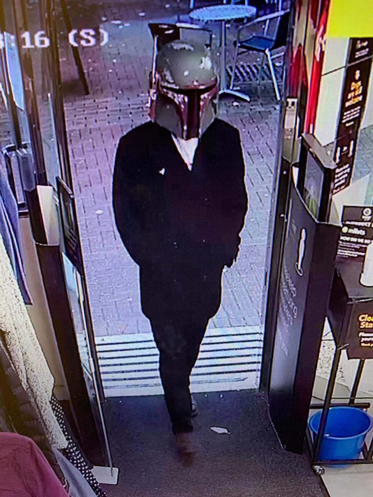 This masked man entered the store