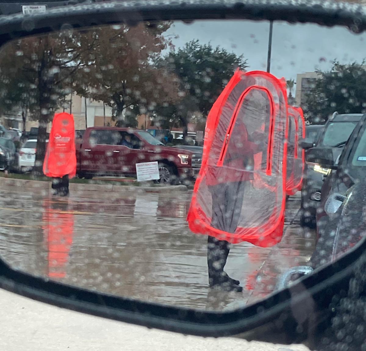 Chick-fil-a workers with the human traffic cone look