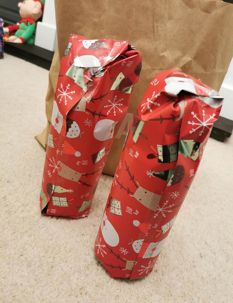 I am German, have a master's in mechanical engineering and design jet engines for a living. Everything in my being calls for precision and this is my best attempt at wrapping my Christmas presents