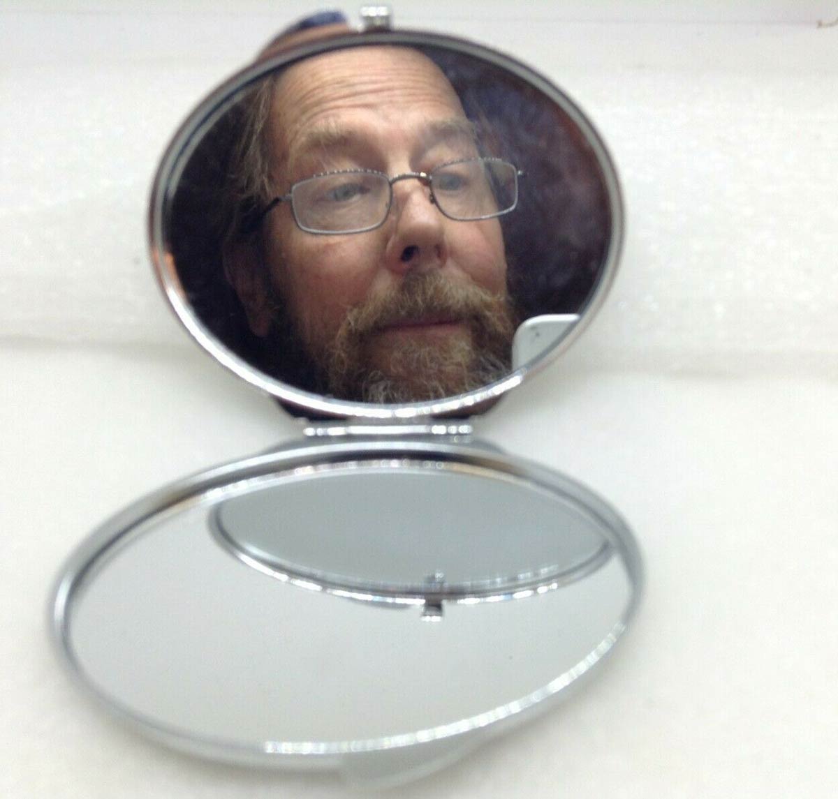 My dad listed this pocket mirror on ebay. Said he wanted people to know that it worked