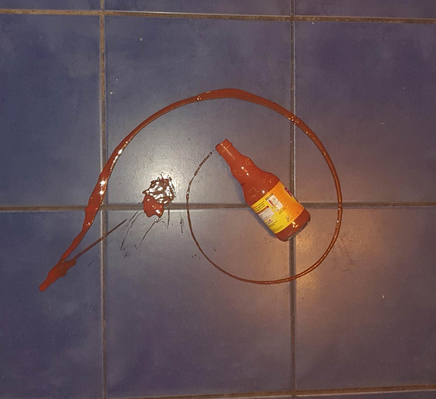 Dropped my bottle of Frank's hot sauce from the fridge and the spillage looks like the golden ratio. The universe is trying to tell me something