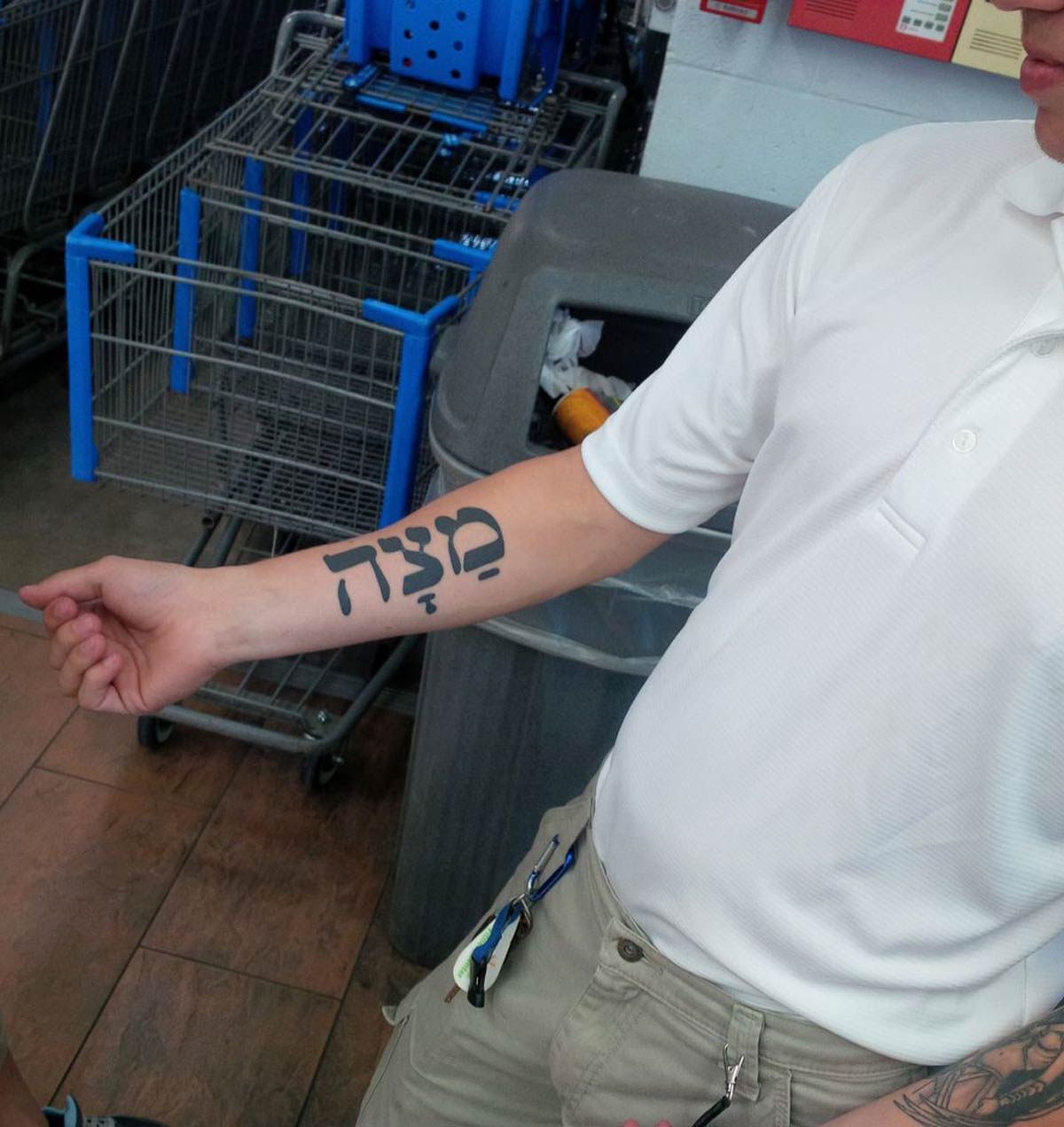 In a Walmart in Bentonville, AR and we see a guy with a huge Matzah tattoo. He says it means 'strength'. We didn't have the heart to tell him
