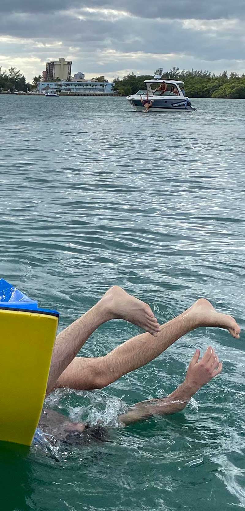 I got a pic of my boyfriend falling off a floaty and just realized there was a guy falling off a boat at the same time