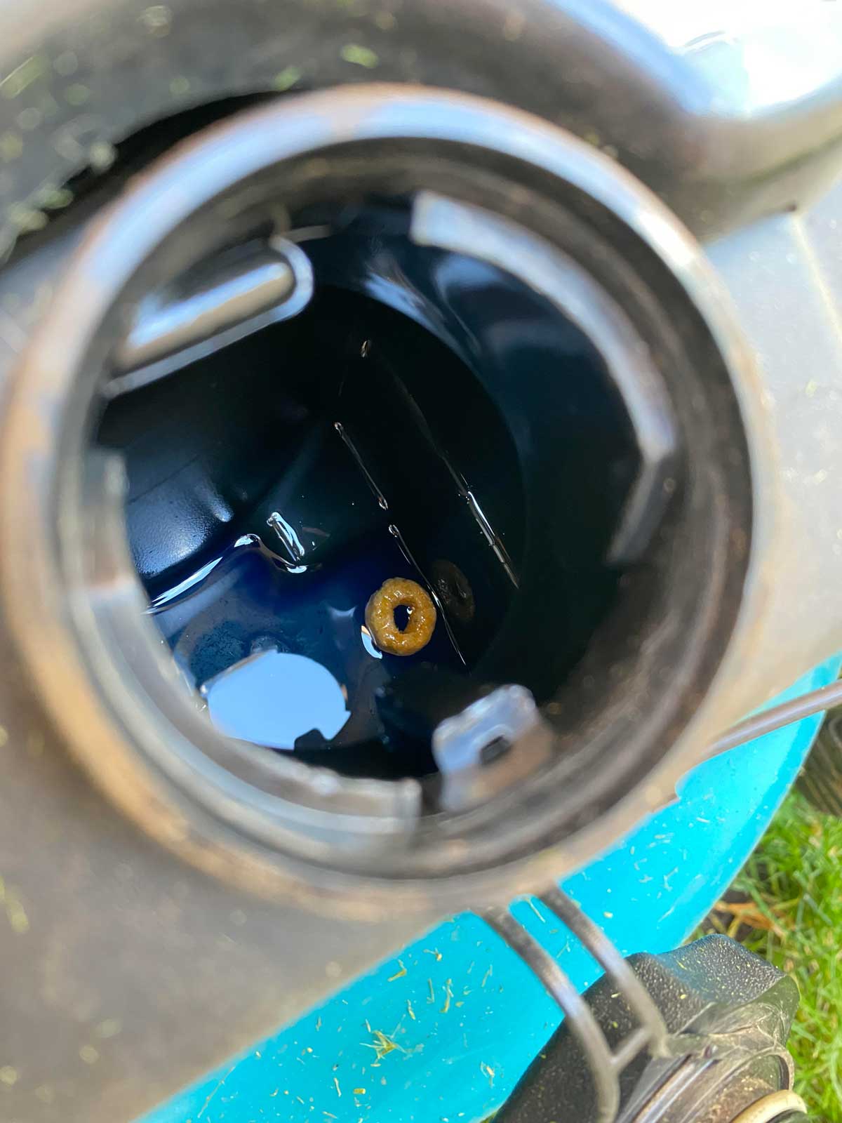 Went to fill up the gas tank and noticed my son has been "feeding" the lawn mower