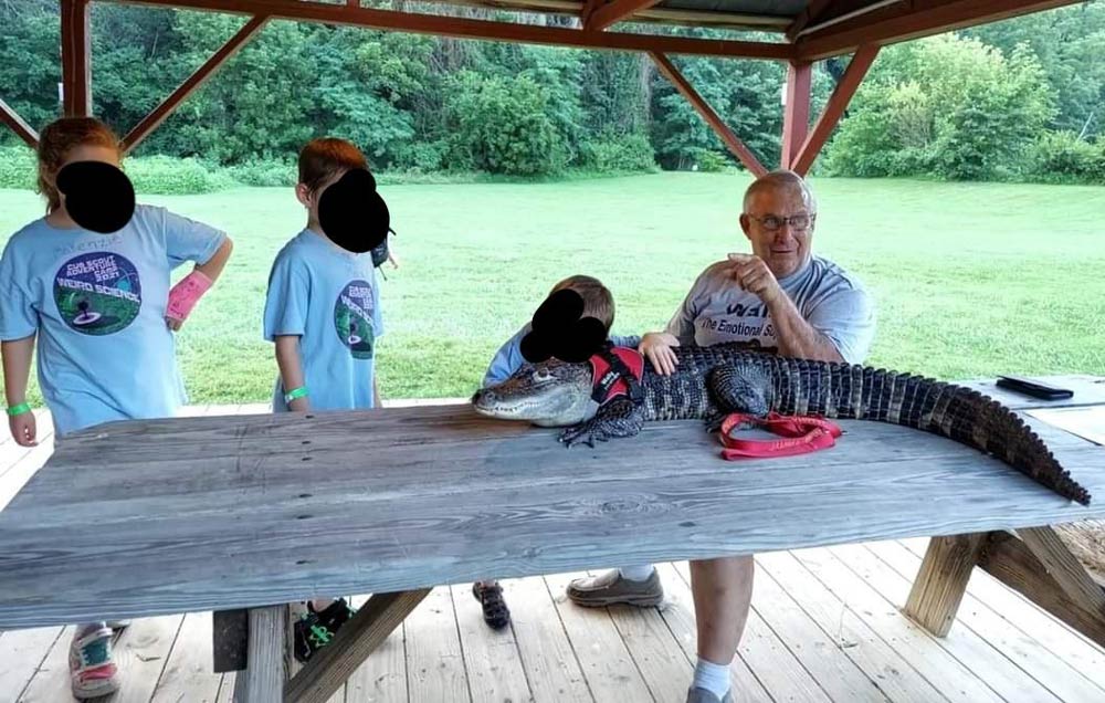 Our Cub Scouts met a man with an emotional support alligator named Wally