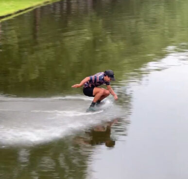 Crossing a Canal on a Skimboard