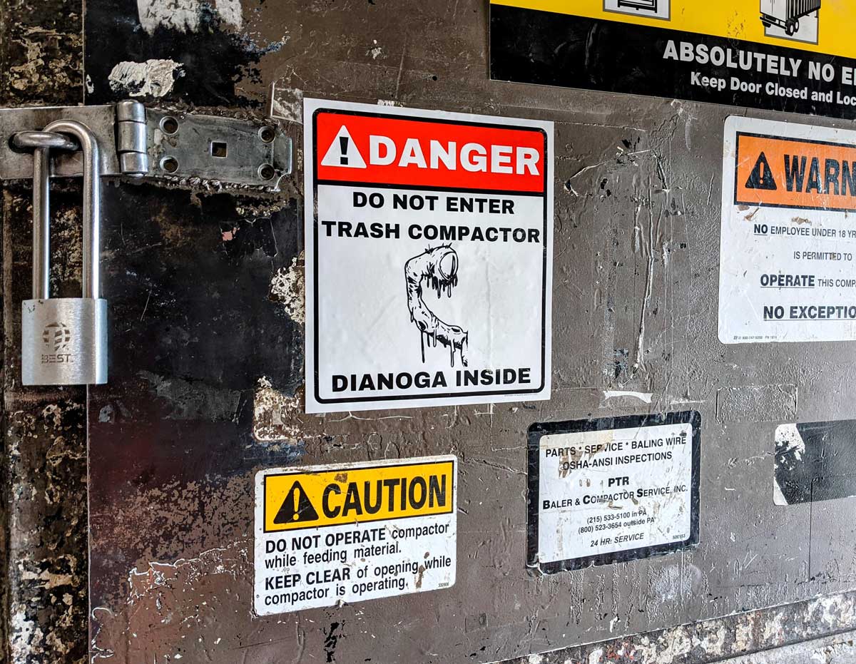 We got a new warning sign for the trash compactor