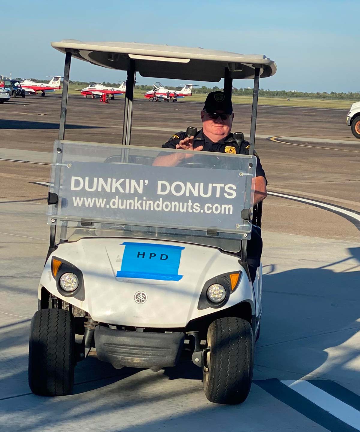 Houston Police officer in cart sponsored by Dunkin' Dounuts. Seen at Wings Over Houston airshow