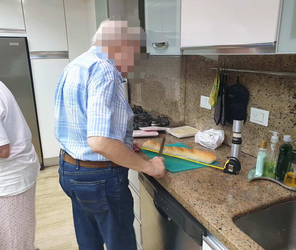 My dad, a compulsive precisionist, uses measuring tape to divide a baguette in exact thirds