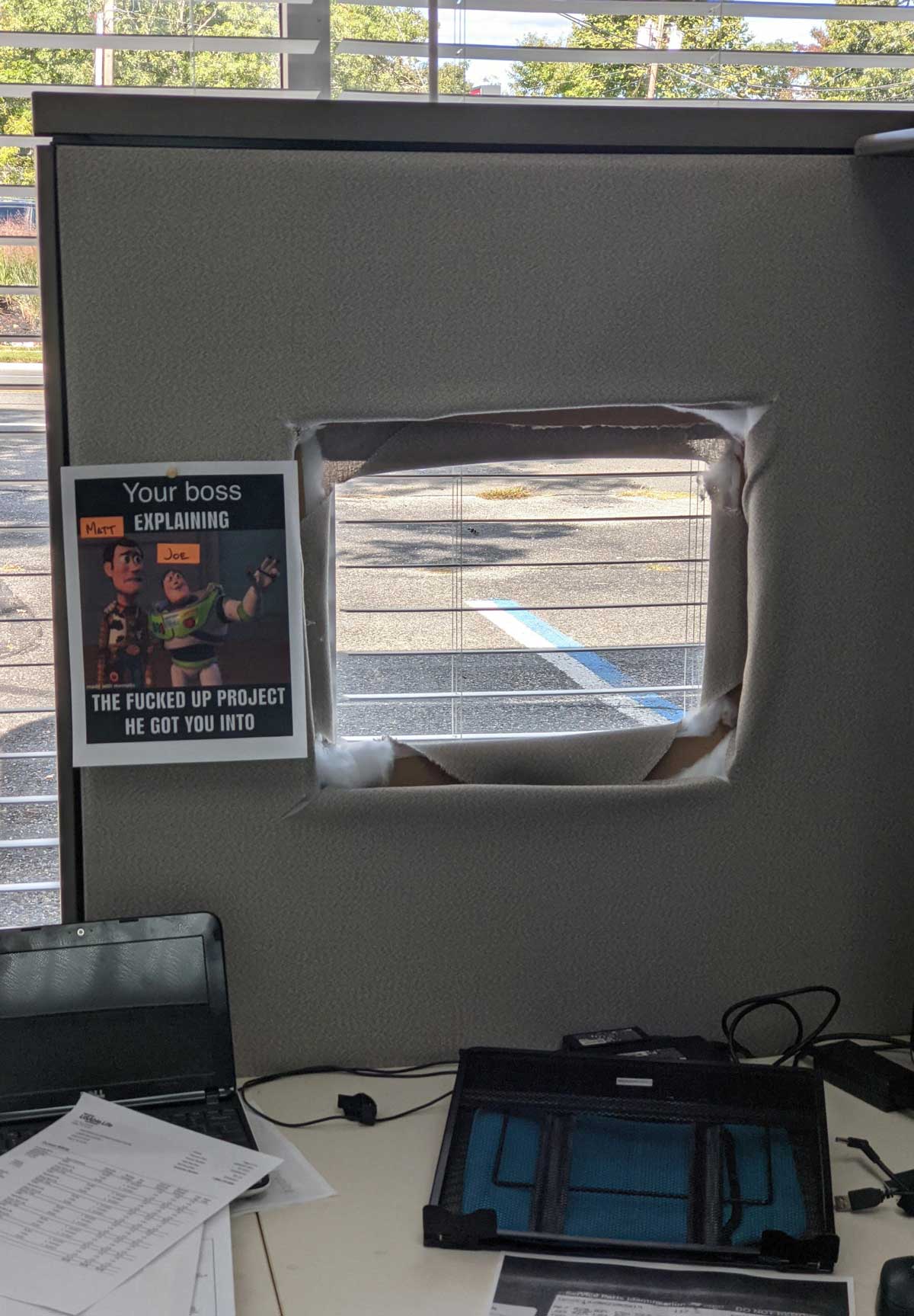 Got new cubicles installed at work. They were installed incorrectly, blocking the window, so my boss improvised