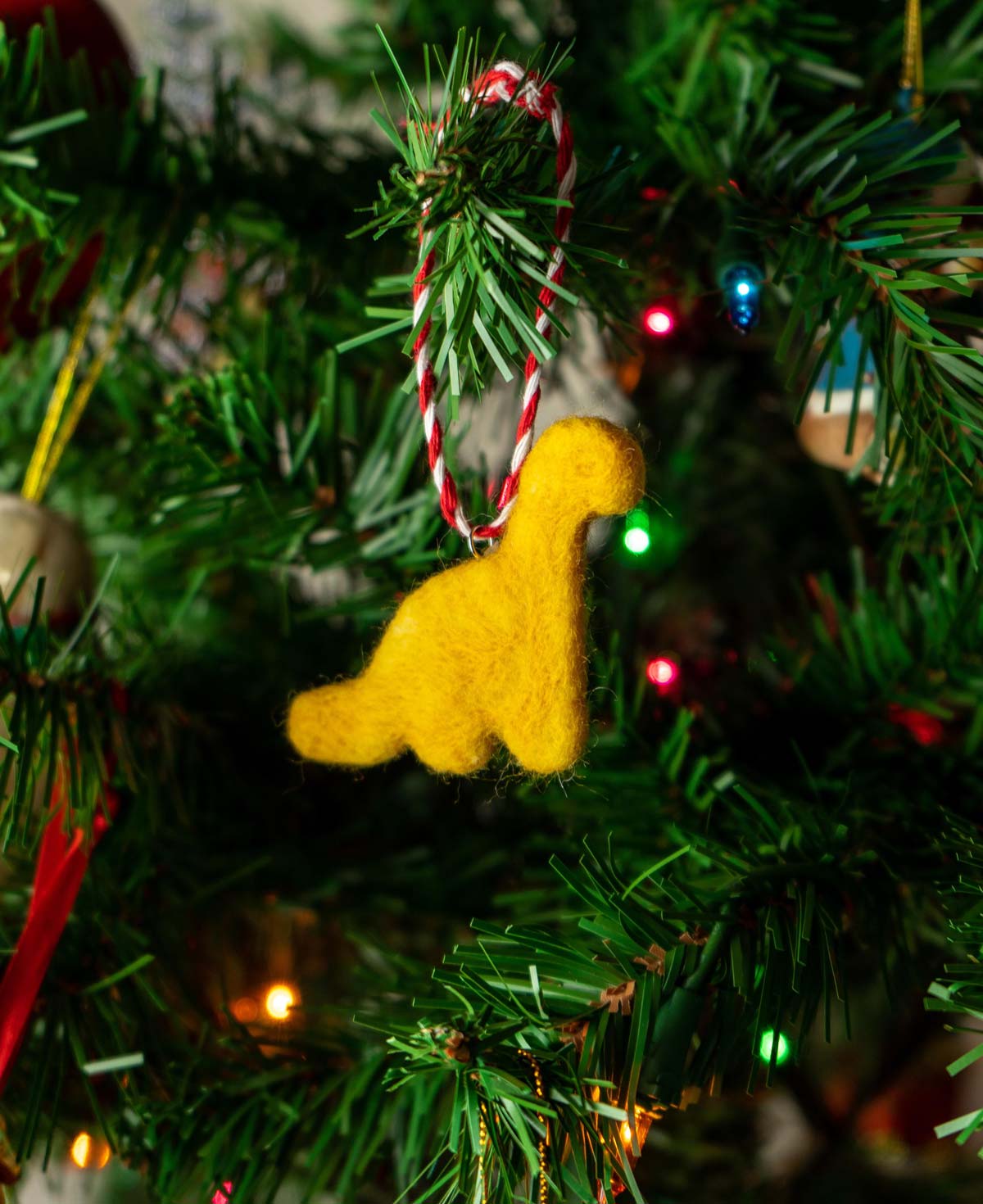 I make felted dino nugget Christmas ornaments
