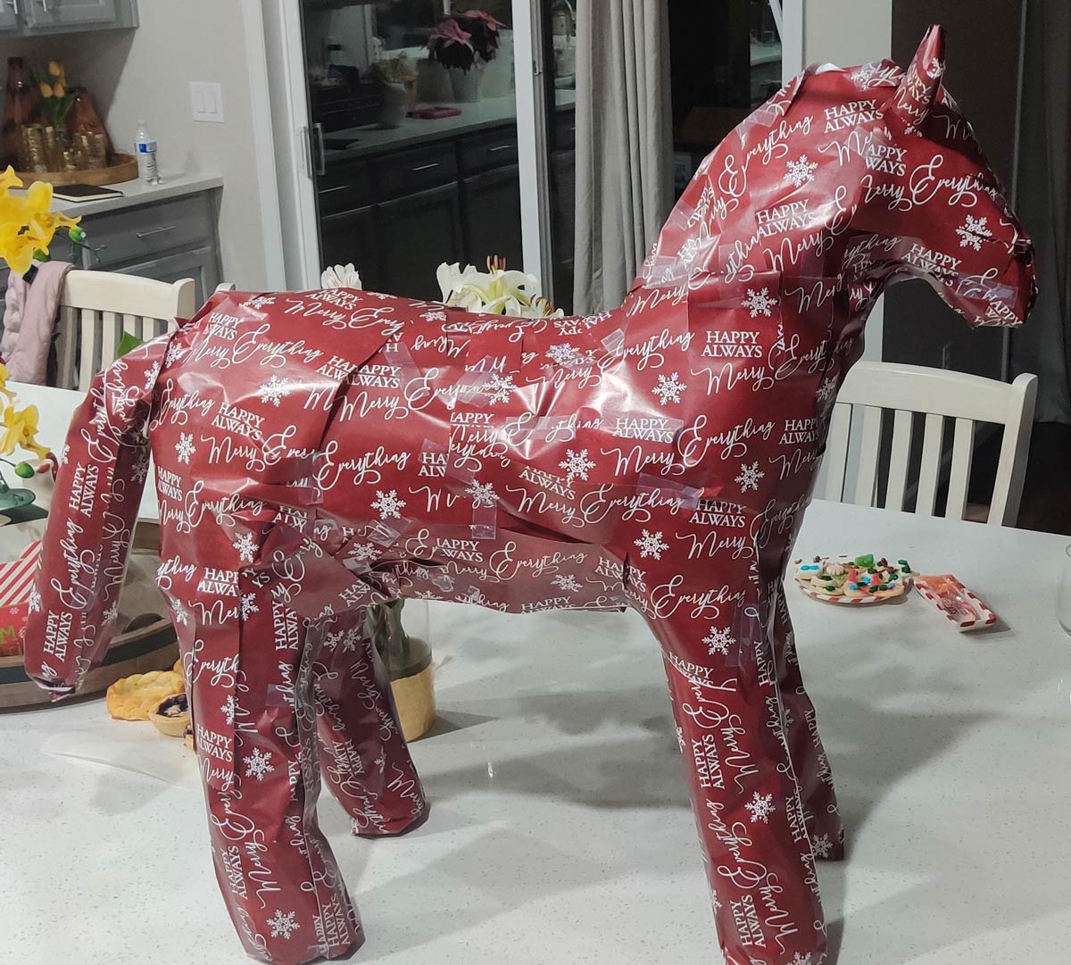 My daughter is obsessed with horses, but I can't afford to buy her one. Bought her a gift card for riding lessons and wrapped it like this