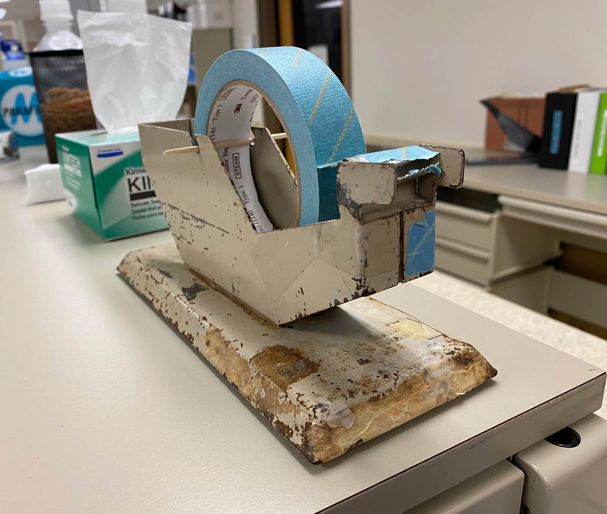 This multi-million dollar hospital lab I work in, with huge analyzers and new equipment manufactured months ago has a tape dispenser from 1960's, held up by a toothpick