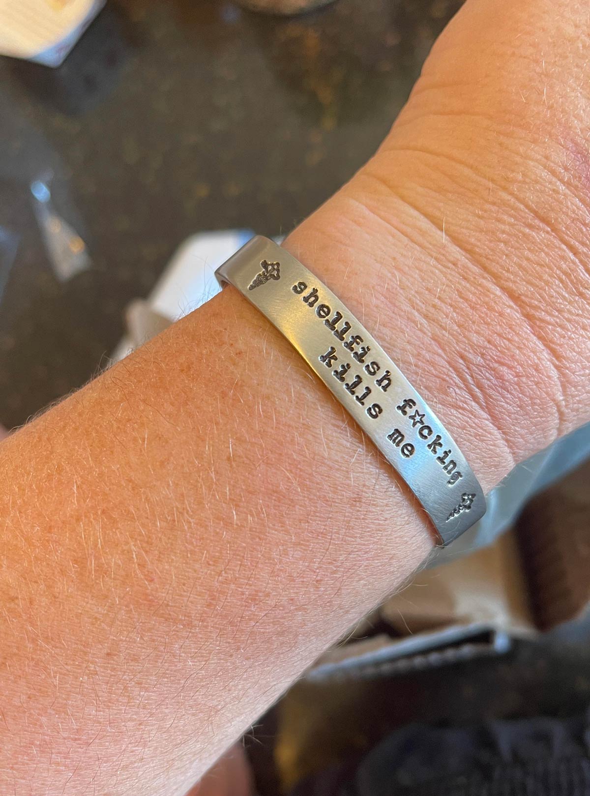 I developed an anaphylactic shellfish allergy last month at age 41. I’m pretty pissed about it, but my medical alert bracelet makes me smile