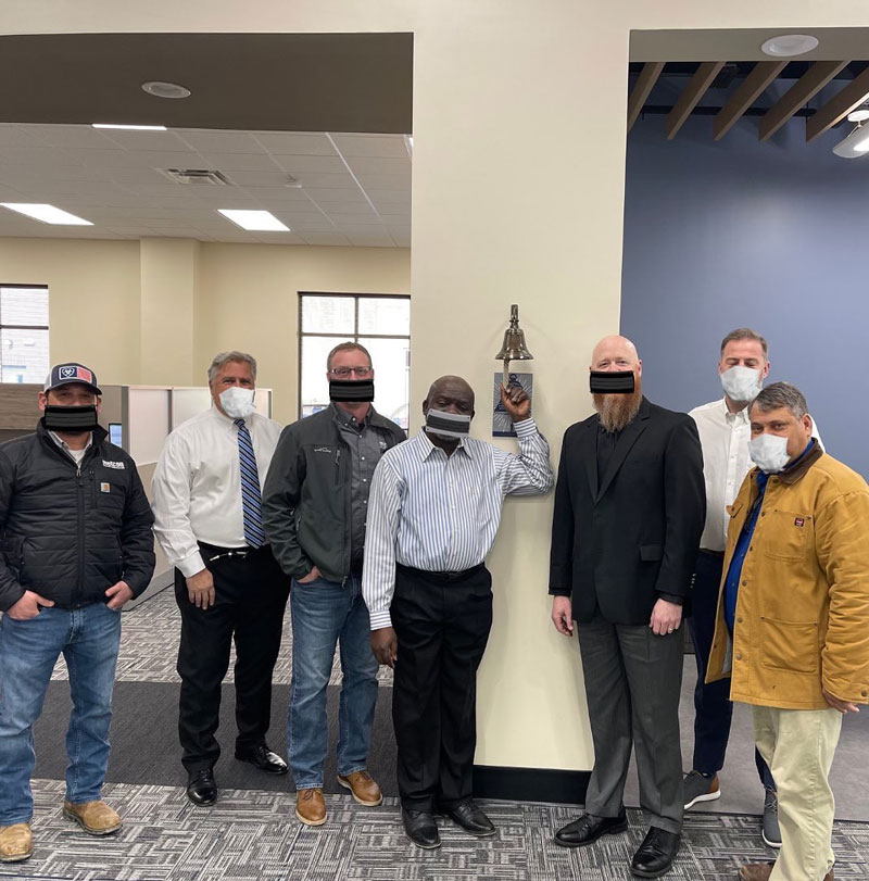 This construction company photoshopped masks on their employees in a photo to celebrate the completion of a new dormitory building at UNCSA