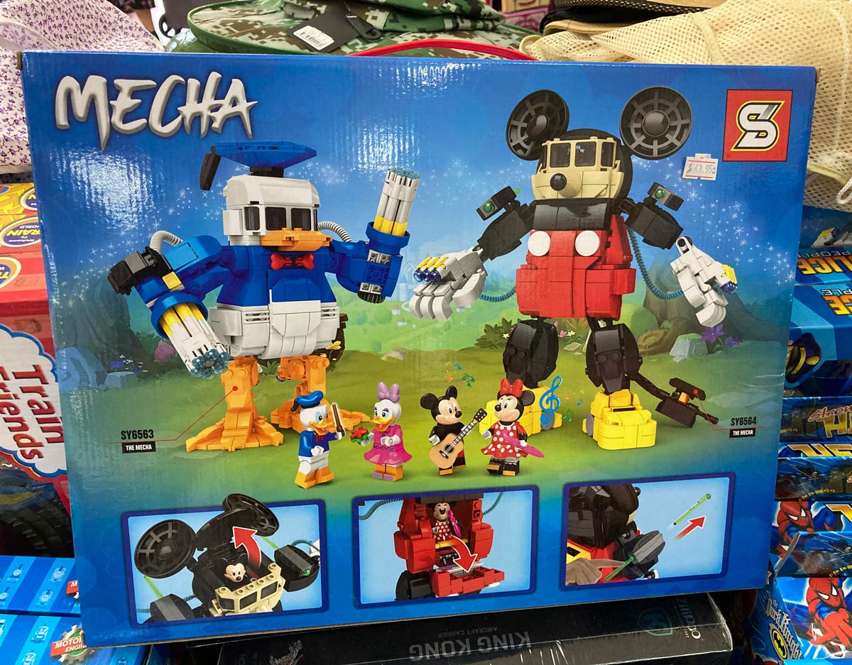 Donald Duck Lego knockoff with miniguns as hands
