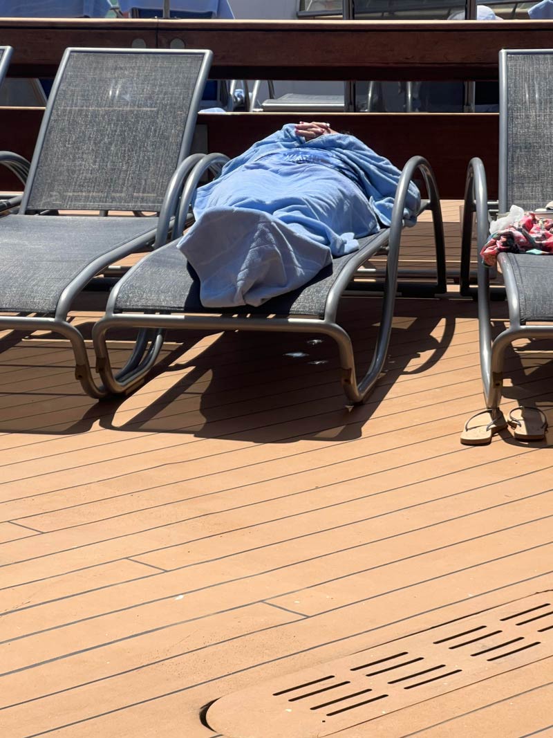 Sitting on the deck of a cruise ship with the Mrs playing our favorite game - "Asleep or Dead". My wife is winning 3 to 2..