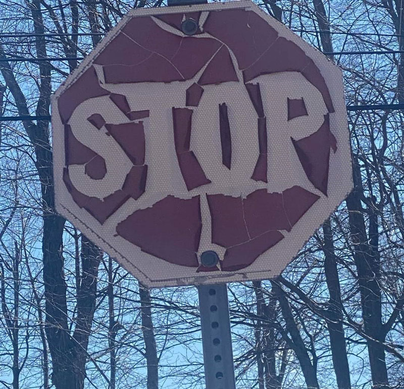 A stop sign in my town is so old, it's become a death metal band logo