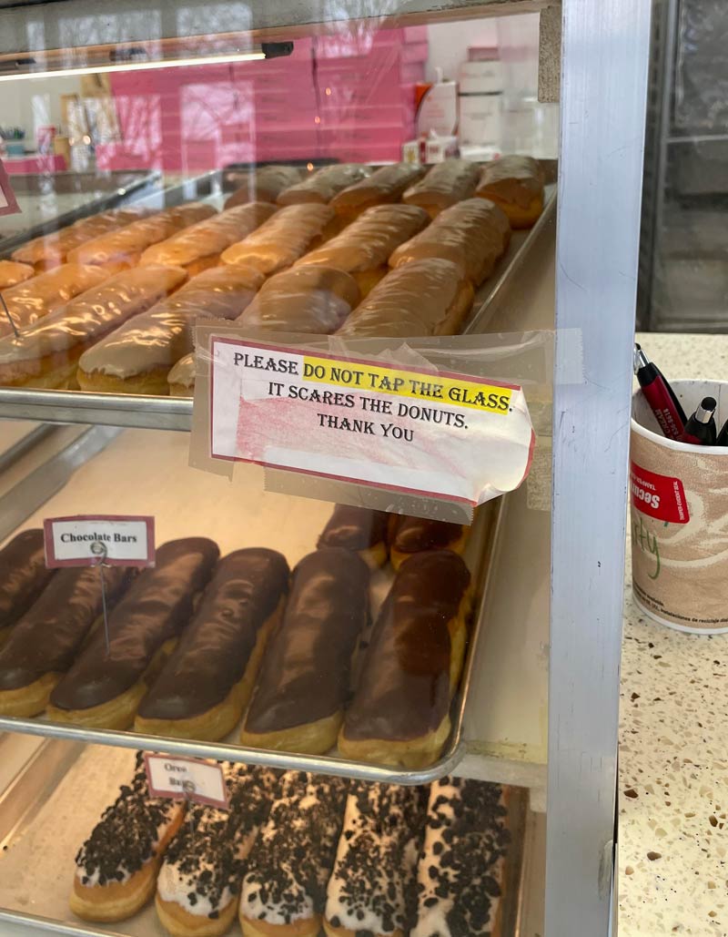 Important sign at the local doughnut shop