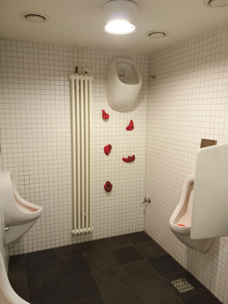 A men's bathroom at a restaurant