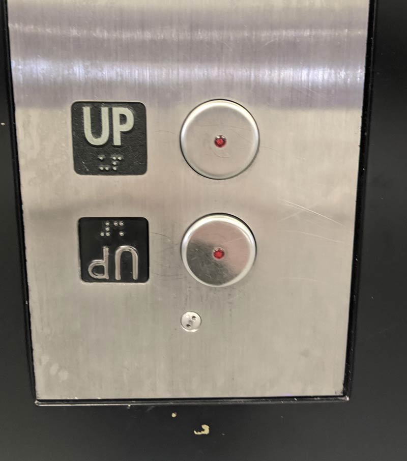 The 'down' button for this elevator is an upside down 'up' button