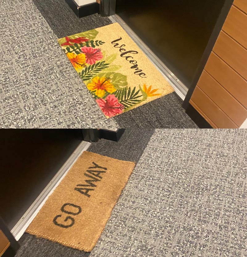 My neighbors and their conflicting door mats. Right across from each other.