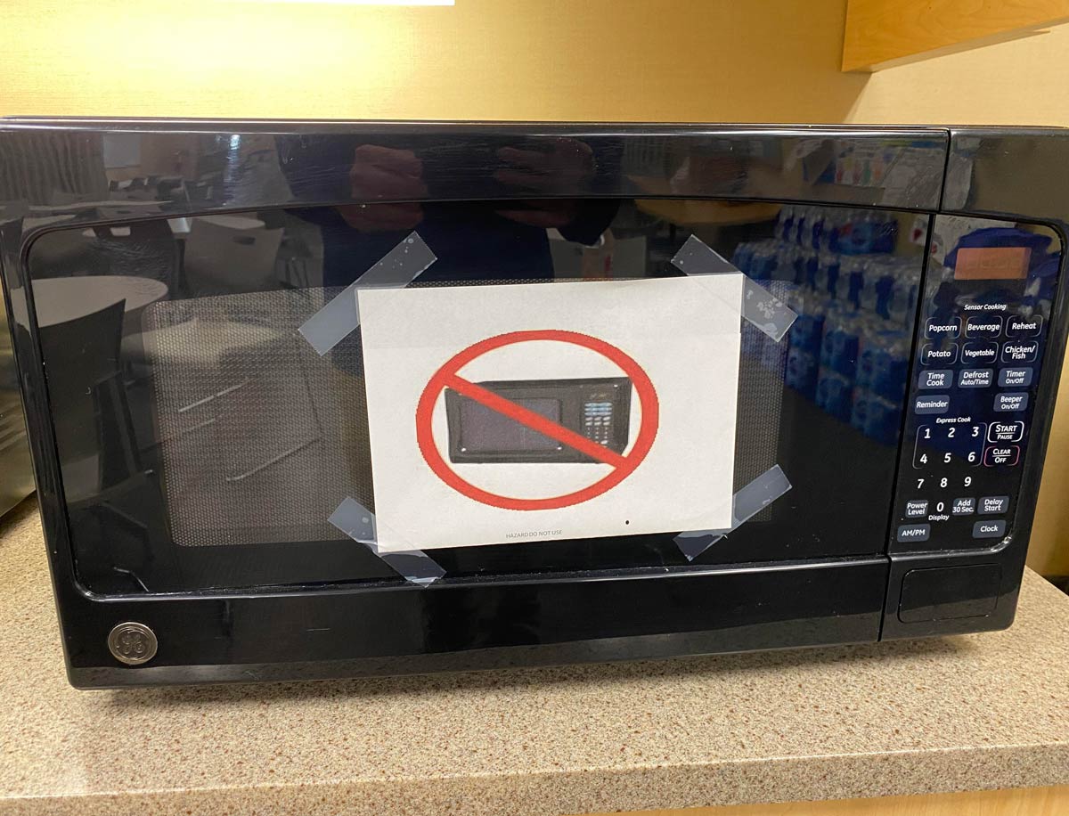 This sign popped up on a microwave at work. Don't microwave a microwave?