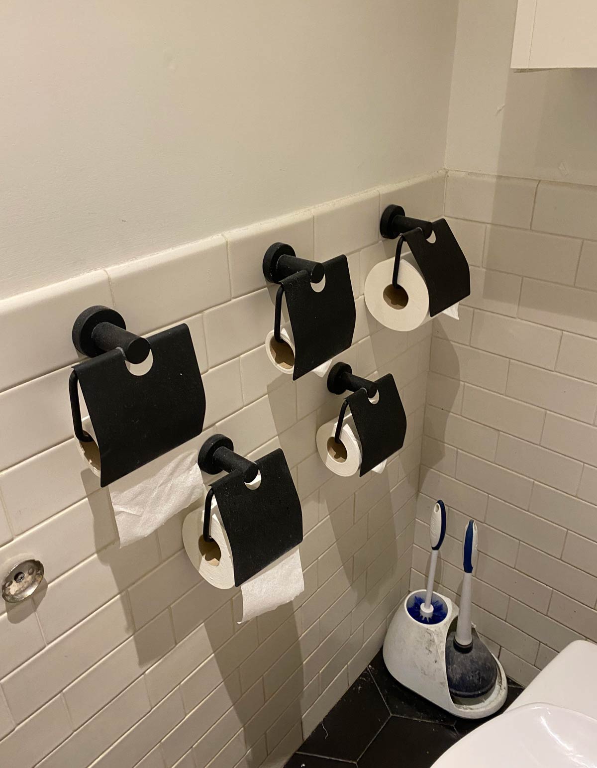 Five toilet paper holders in this bathroom