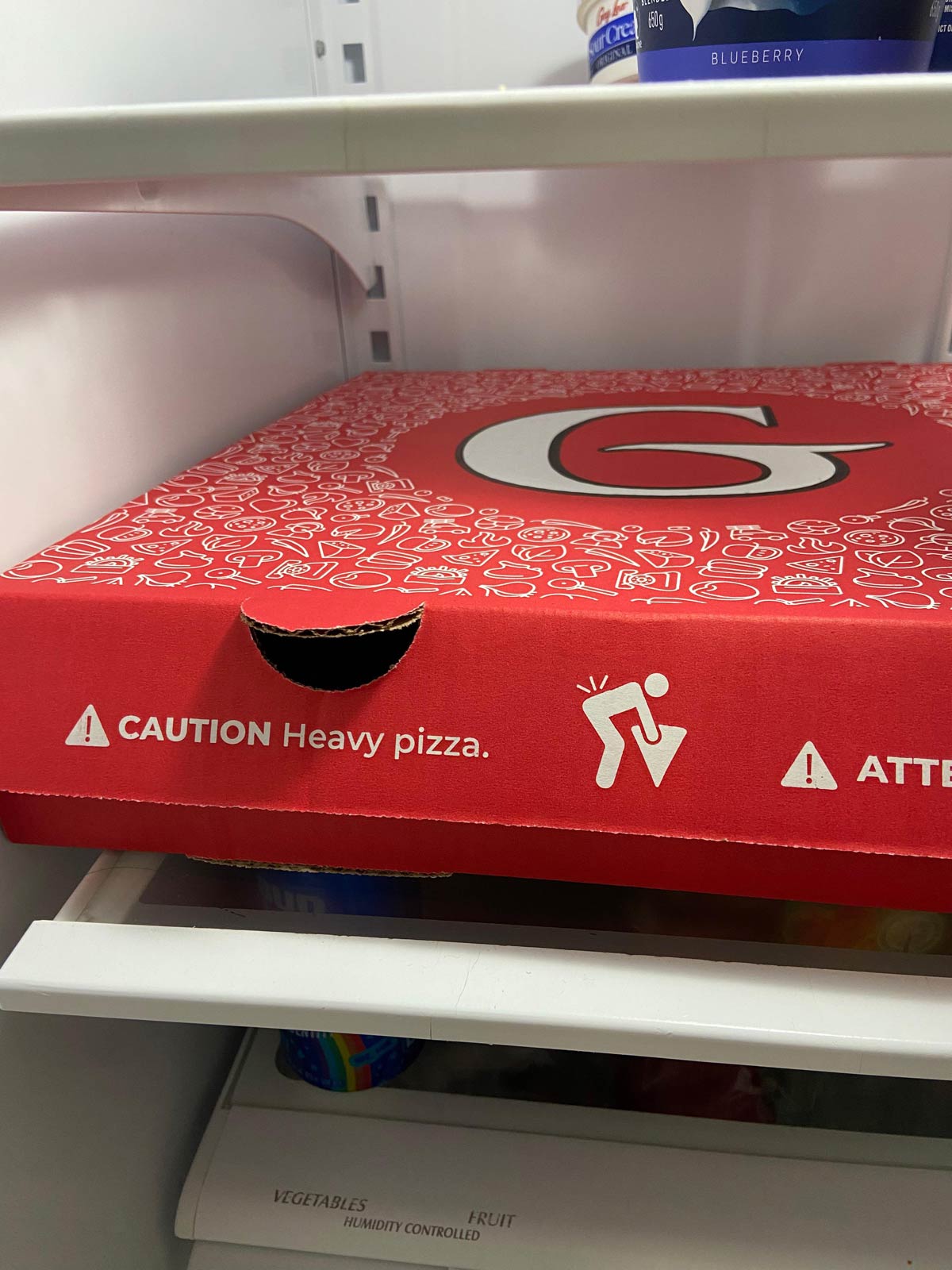 Pizza box has a warning