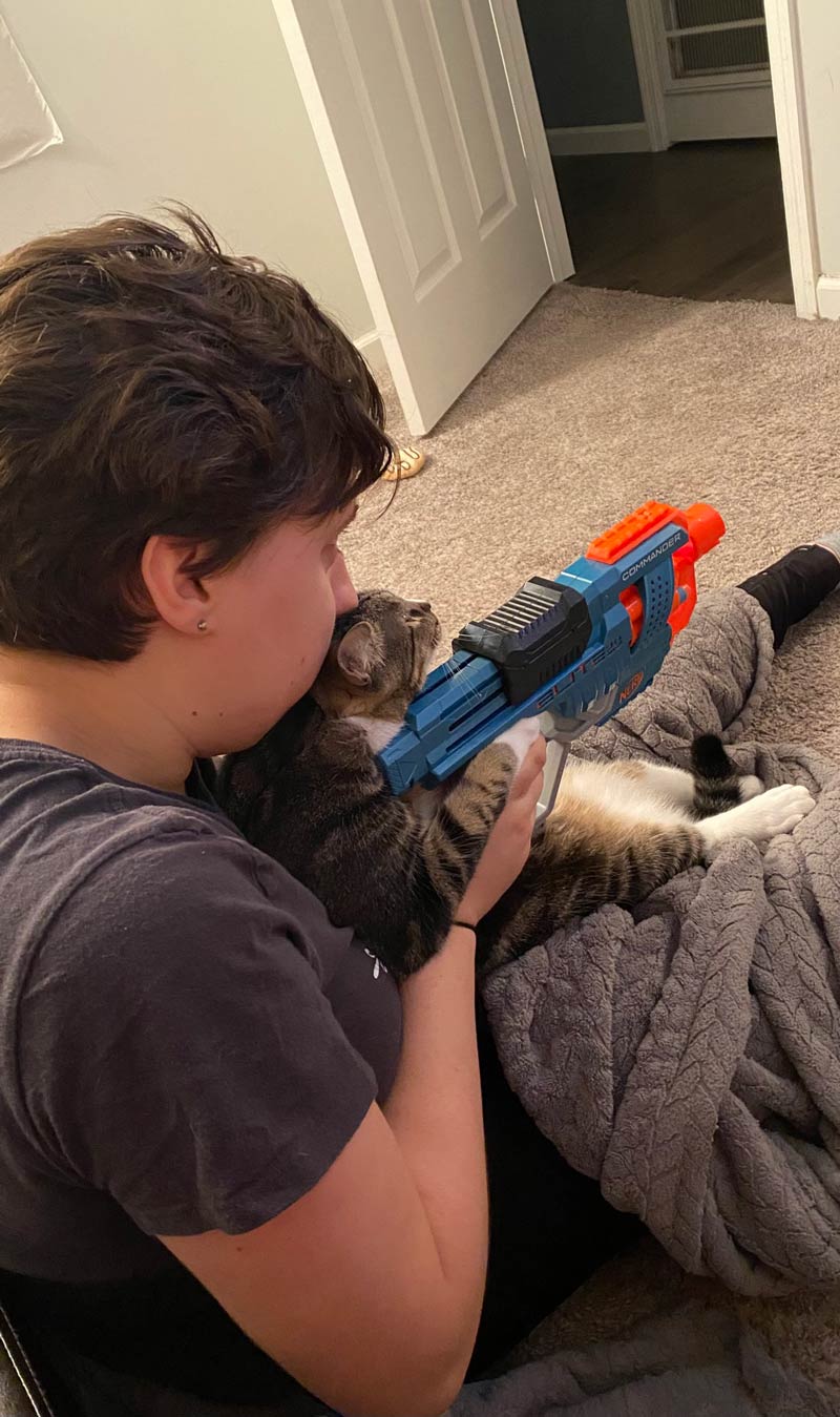 Girlfriend teaching cat our how to shoot