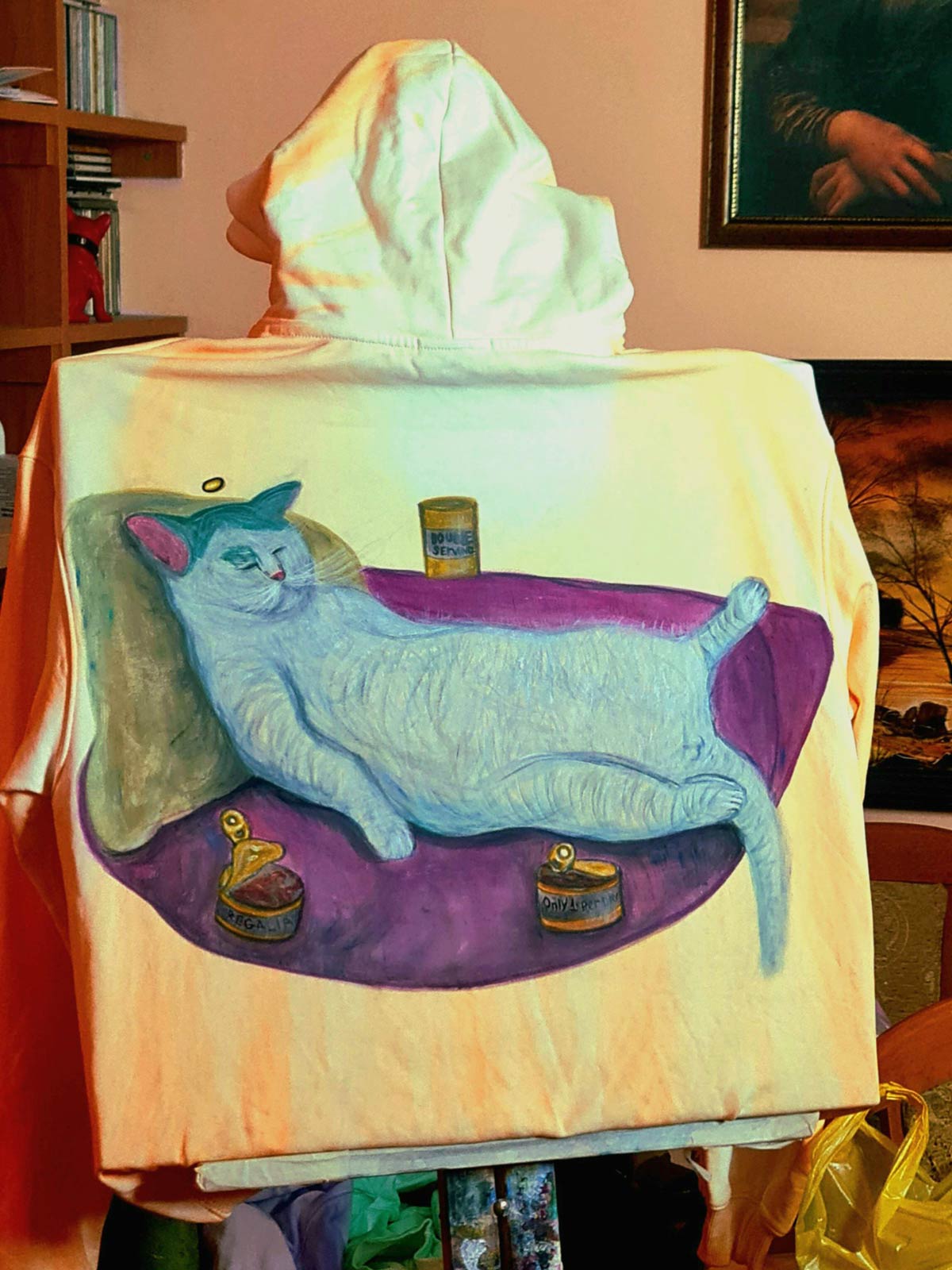 I painted my cat in a food coma on a hoodie
