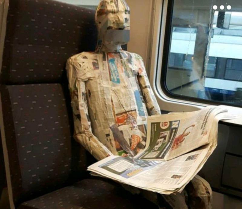 Saw a newspaper reading a newspaper on the train today