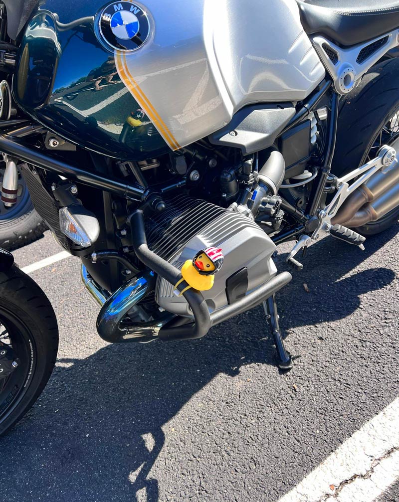 This motorcycle has a rubber ducky wearing a helmet