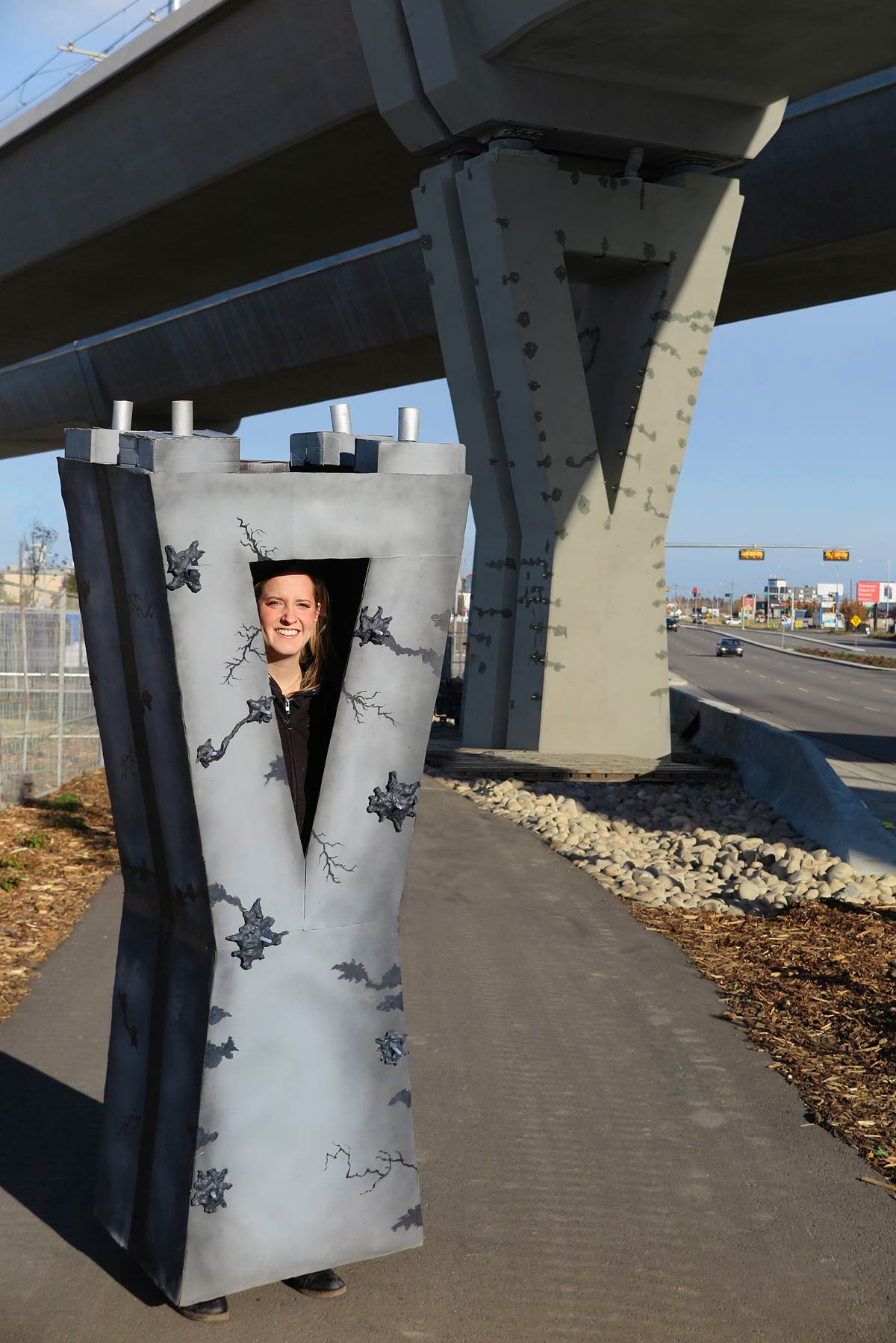 City builds multi-million dollar concrete pillars, they crack after 6 Months. Woman dresses up as one for Halloween. She Writes, "Just wanted to show my... "SUPPORT"!"