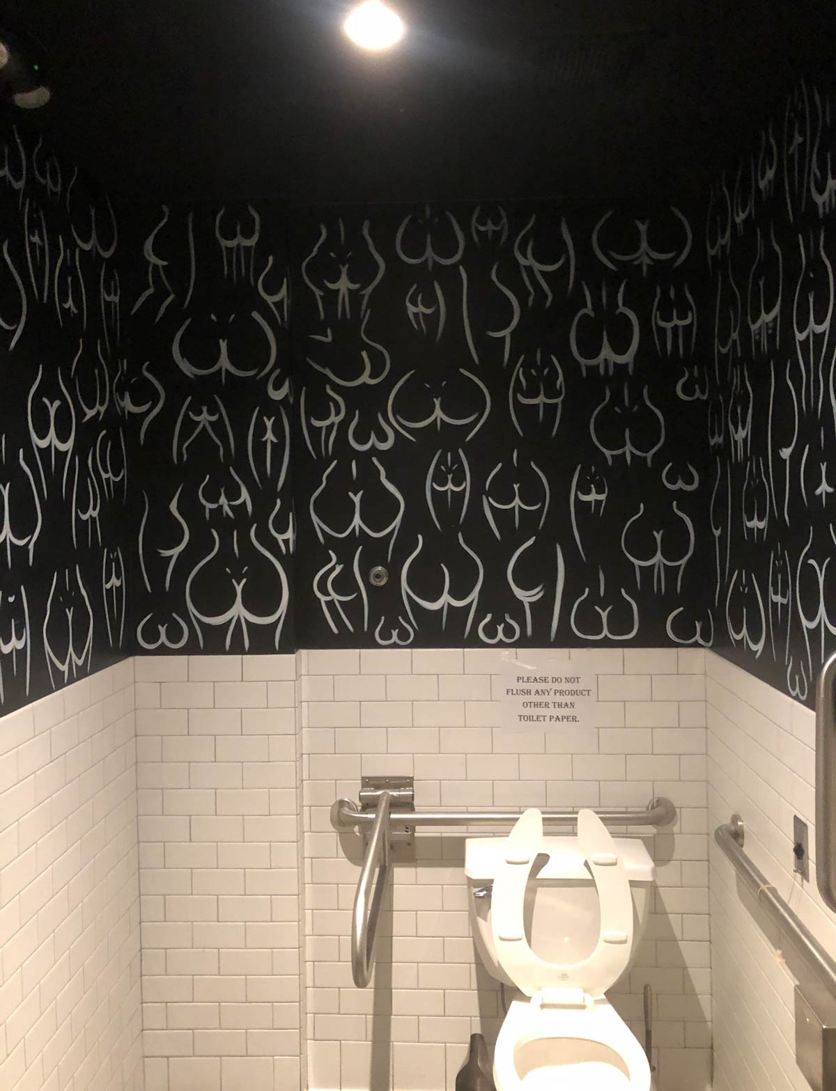 This bathroom has unique wallpaper