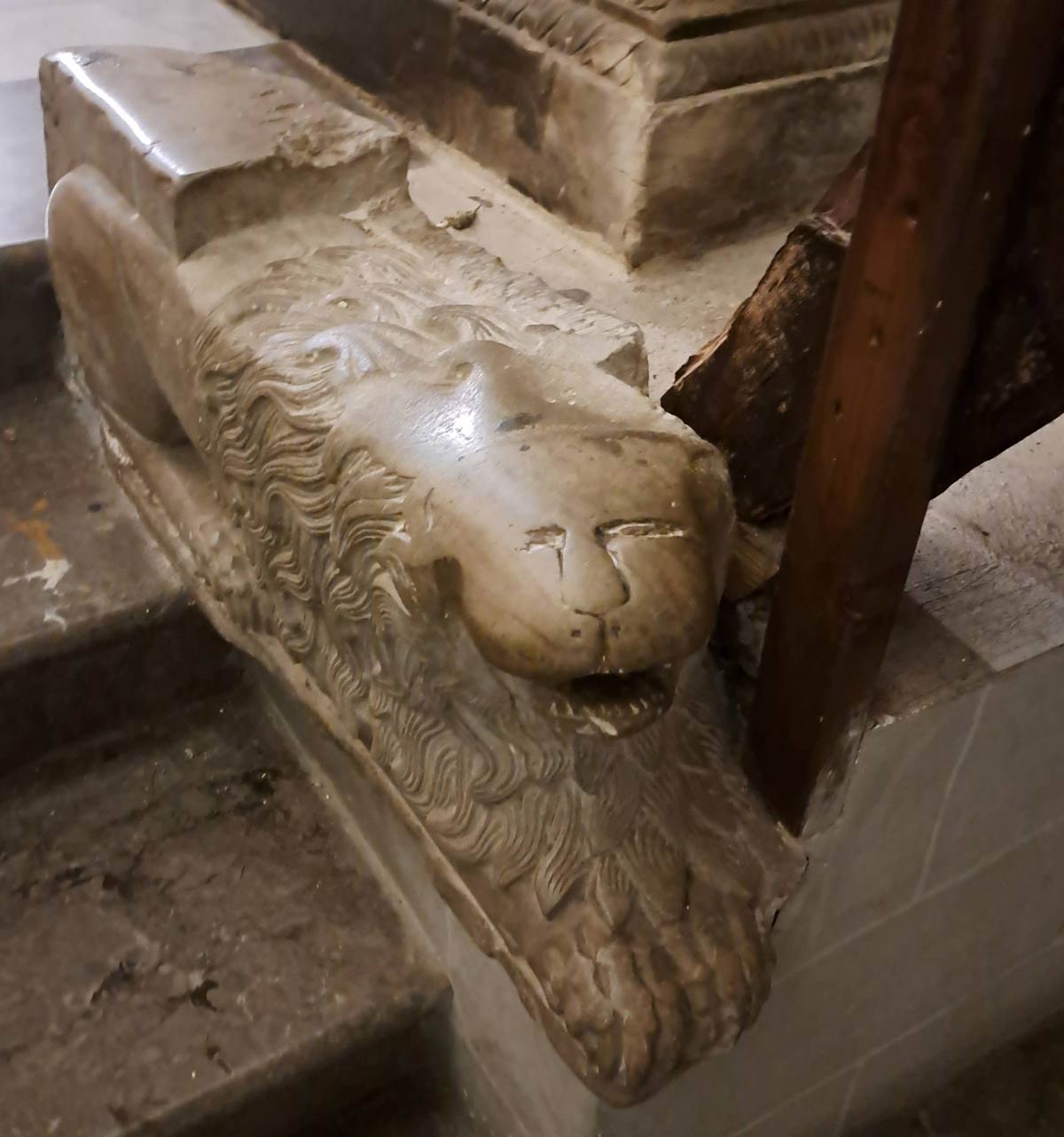 Excessively petted lion statue