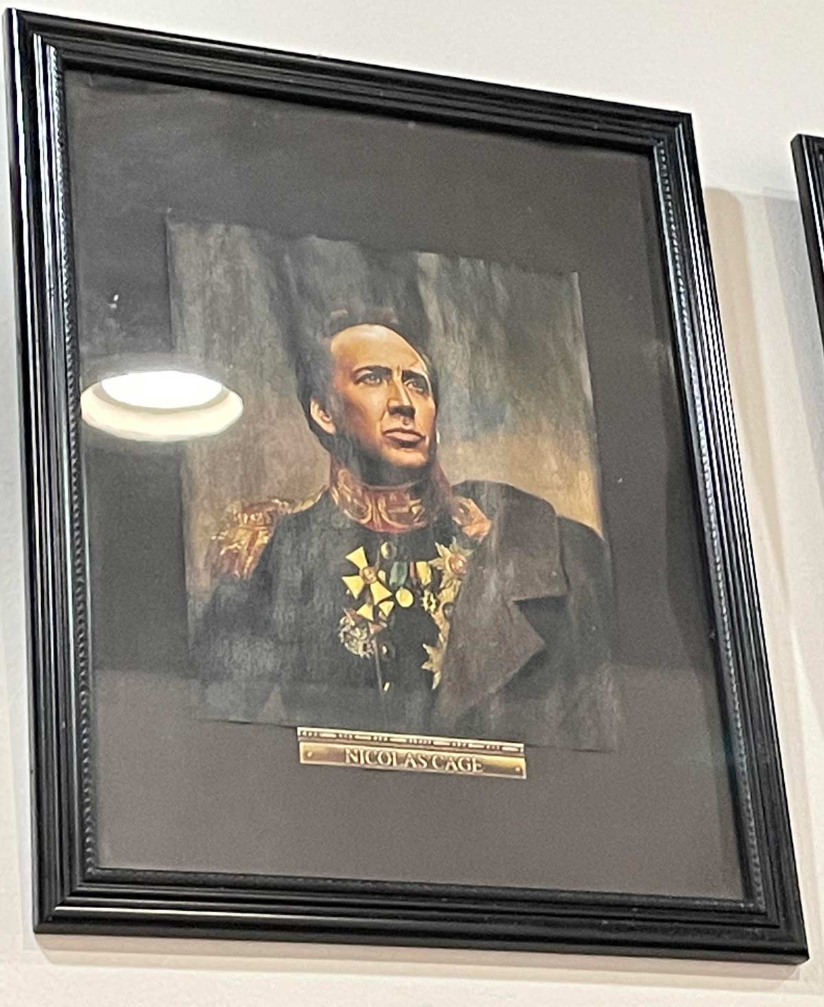An Asian restaurant in NYC has a picture of Nic Cage in some sort of European Military uniform / regalia