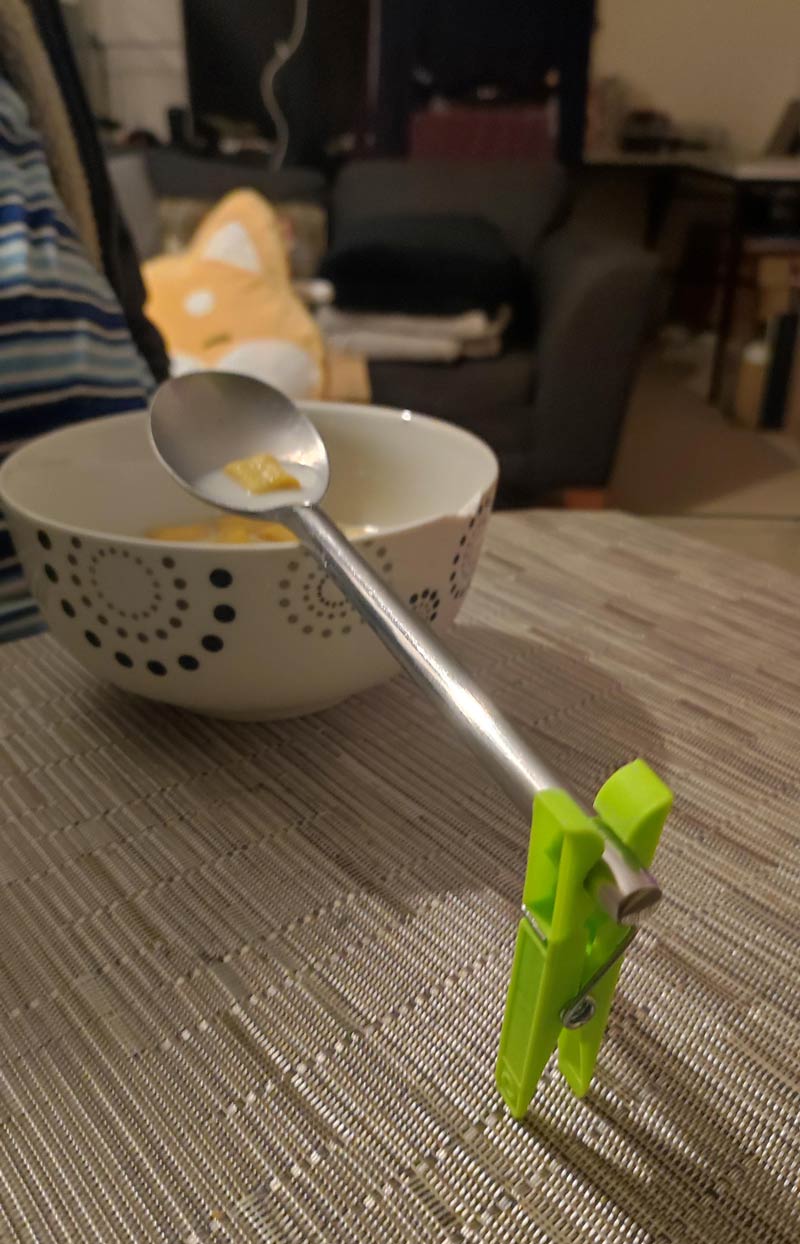 My boyfriend's solution to hold the spoon when he eats cereal