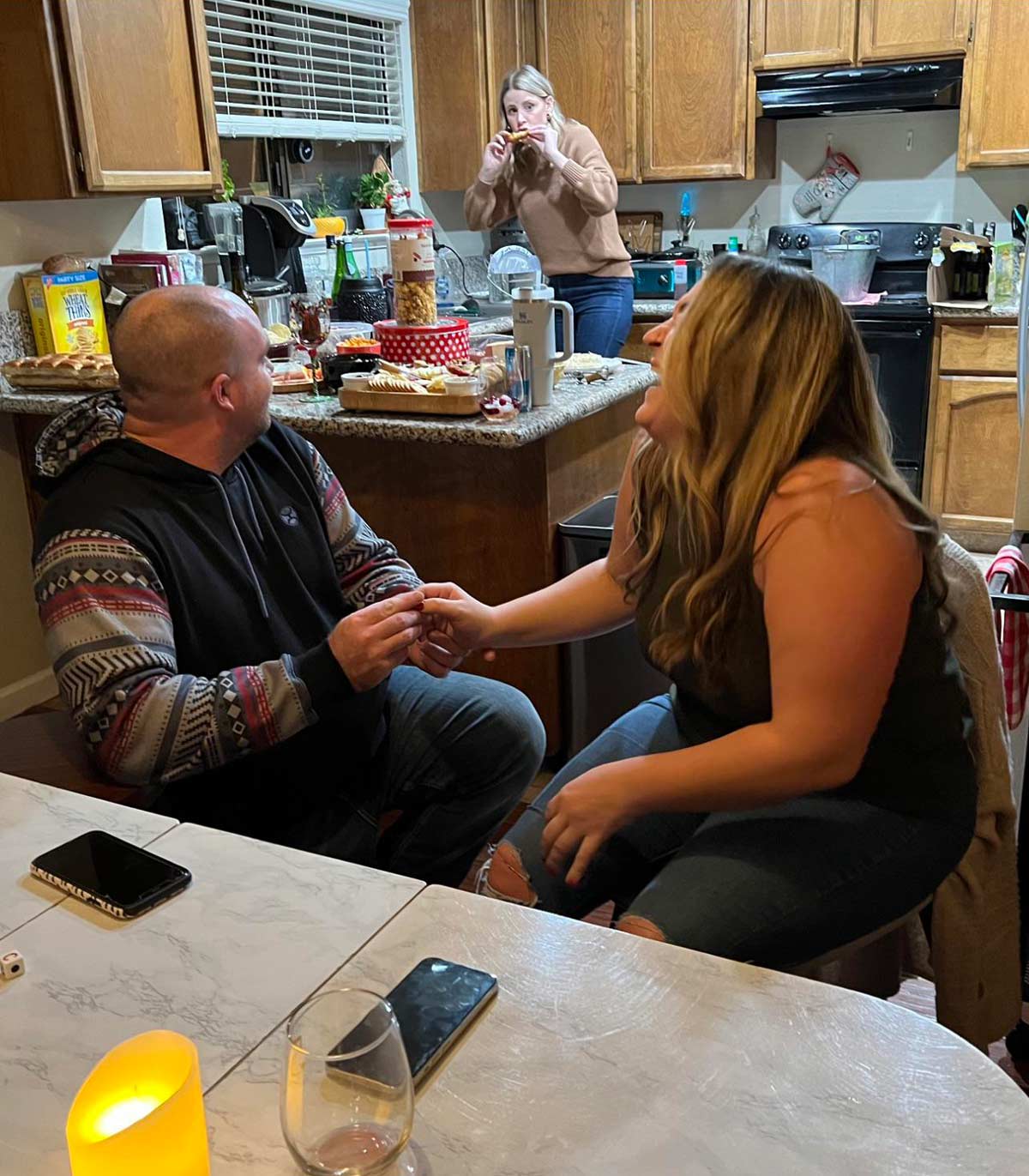 Our friend mid-chicken wing realizing I’m proposing to my girlfriend on NYE