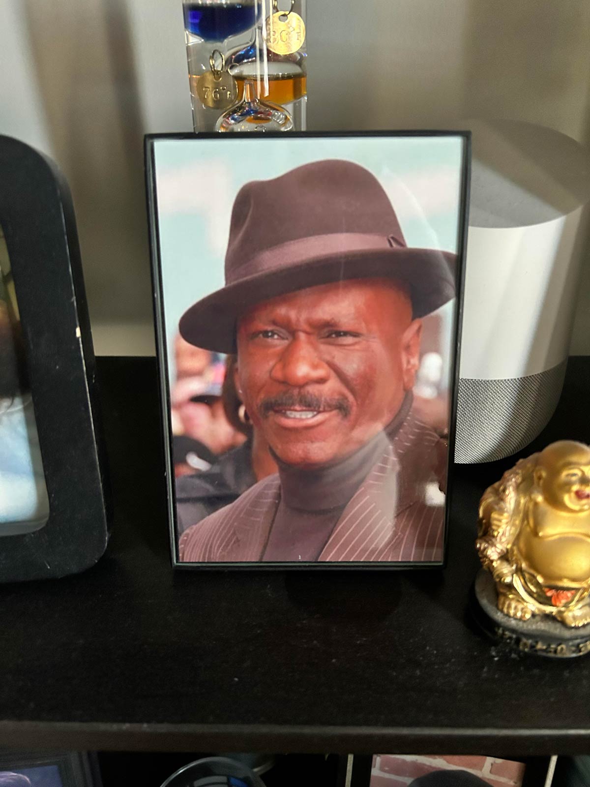 My wife's best friend has a framed photo of Ving Rhames on the shelf with all his family photos