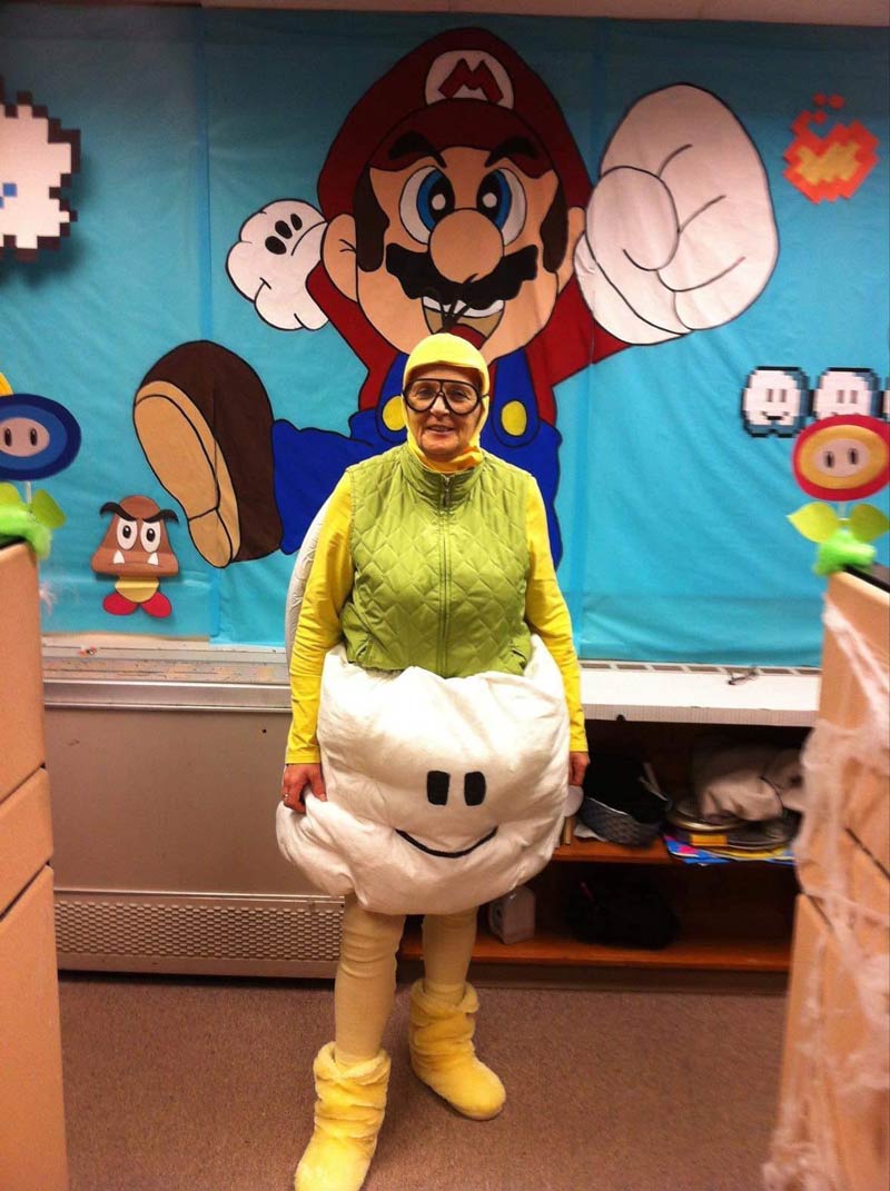 My Mom, who designed a Mario themed party at her office (all by hand) dressed as Cloud guy!