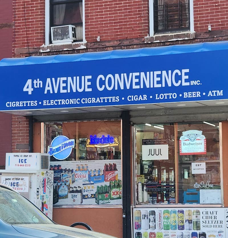Two unique misspellings of cigarettes on one awning