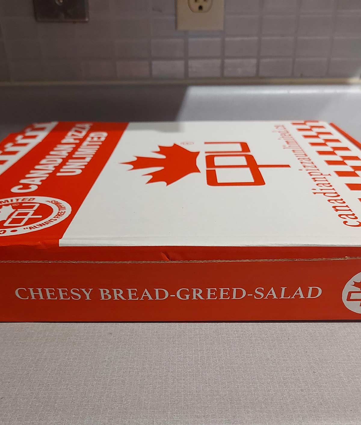 My pizza box had a spelling error, the word Greek was changed to greed